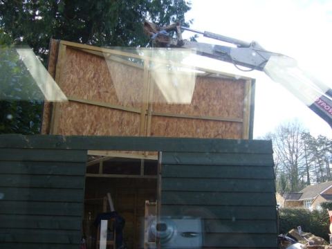 using the digger to move the 'modular' shed - its heavy!