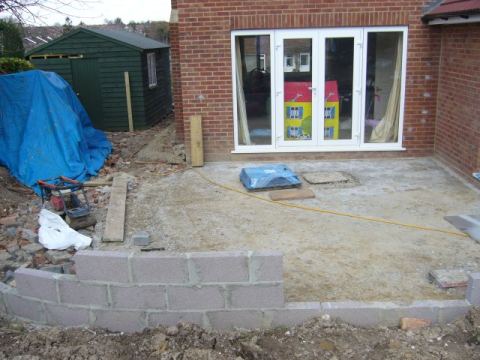 retaining wall and patio base (which will probably be our patio for the rest of the year)