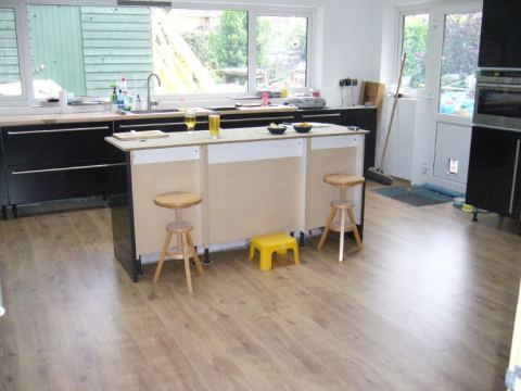 Erin can't really reach the island worktop from her stool
