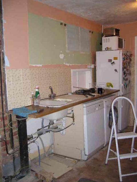 ripping out the old kitchen.. this is more like it - love those tiles