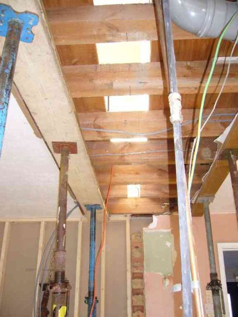 ready to cut the upstairs floor in half to insert the new beam