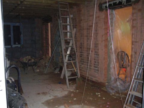 dad helps out again and puts in the doorways to the new lounge..
