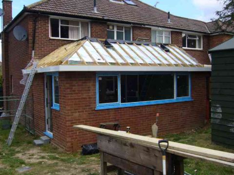 rubber roof on, windows in and thousands of pieces of celotex wedged everywhere joined together with ally tape - hope it doesn't rain