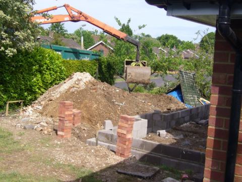 blockwork starting - grab lorry getting rid of some earth