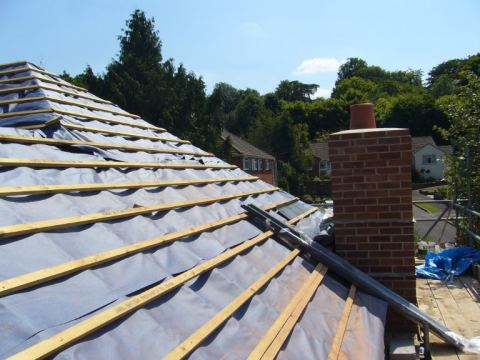 Side felted and battened and the chimney finished