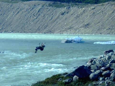 Guy crossing river